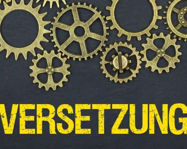 Zahnräder und das Wort "VERSETZUNG" in Großbuchstaben. Ein formloser versetzungsantrag muster könnte hier nützlich sein.