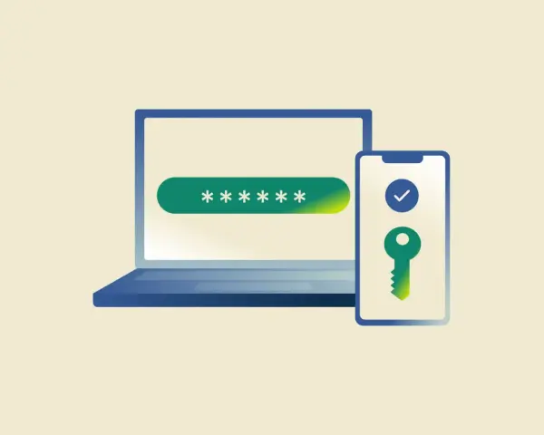 Laptop z polem na hasło i telefon z kluczem symbolizującym zabezpieczenie 2FA.