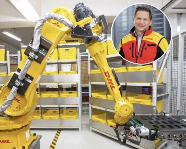 Zautomatyzowany magazyn DHL, duża giełda niemiecka, z robotem i uśmiechniętym menedżerem.