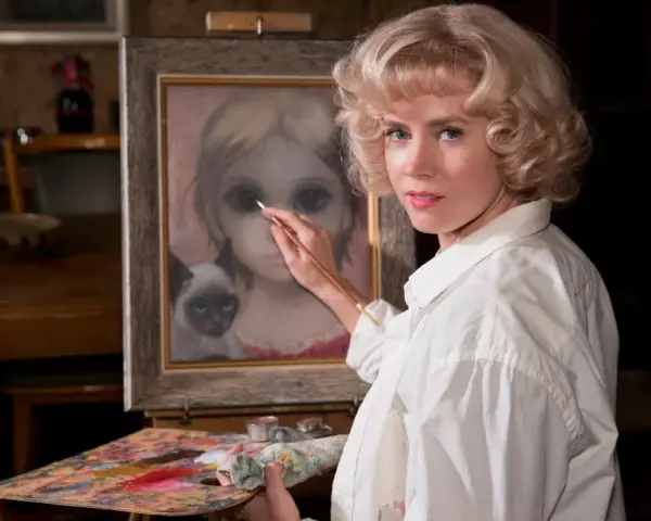 Margaret Keane målar en flicka med stora ögon och en siamesk katt.