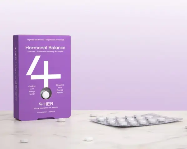 Lila förpackning med "Hormonal Balance" och en tablettkartong. Kan hjälpa mot hormonell obalans symtom kvinna.