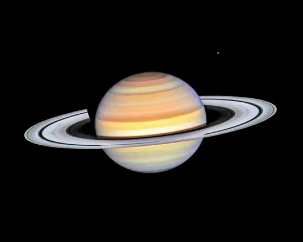 Saturn w Byku, majestatyczny gazowy olbrzym z pierścieniami, unoszący się w kosmicznej pustce.
