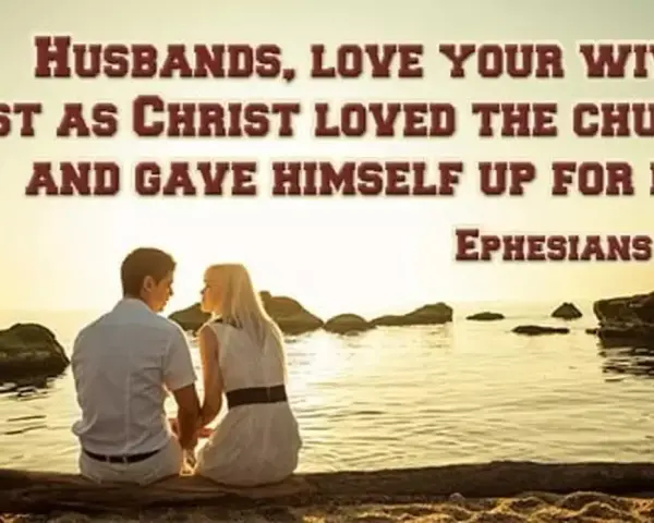 A couple sits by the sea, embodying the biblical definition of love as husbands love their wives as Christ loved the church. Ephesians 5:25.