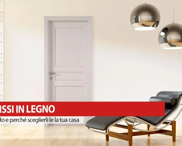 Infissi in legno: pro e contro per la tua casa. Porta bianca, chaise longue e lampade moderne in un ambiente luminoso.