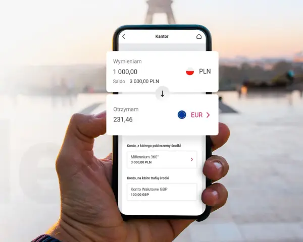 Dłoń trzyma smartfon z aplikacją kantoru. Widoczny kurs wymiany PLN na EUR.