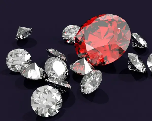 Wokół dużego, czerwonego rubinu, znanego z magicznych właściwości, rozsypane są błyszczące diamenty.