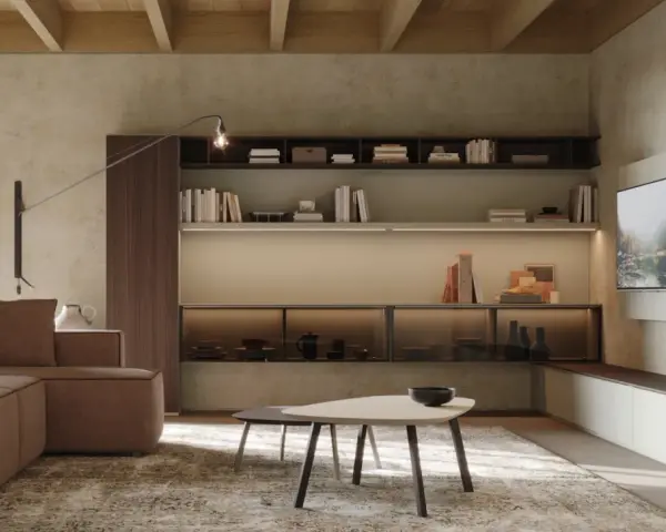 Soggiorno moderno con divano marrone, tavolini e libreria a parete. Le pareti in **colori neutri per pareti** creano un'atmosfera rilassante.