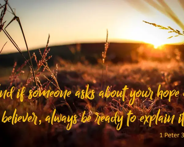 Sunset over a field of grass. Text reads: "And if someone asks about your hope as a believer, always be ready to explain it. 1 Peter 3:15