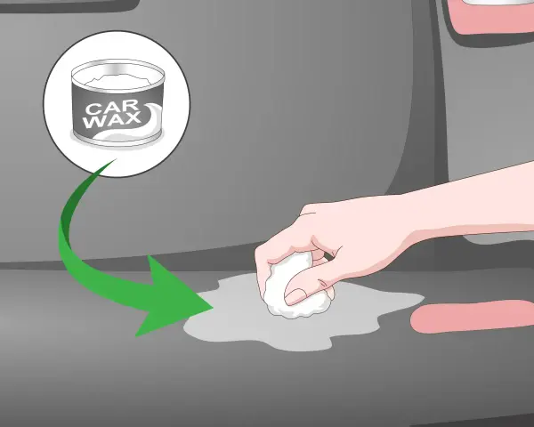 A hand applies car wax to a gray surface, showing how to remove scratches from clear plastic.