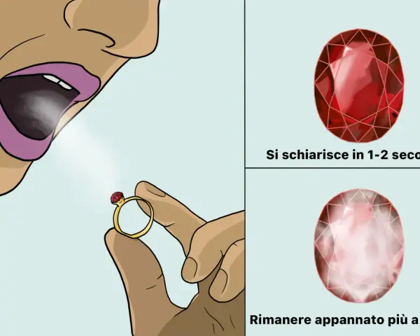 Anello con pietra colore rubino, soffiata si schiarisce subito. Altra pietra rimane appannata.