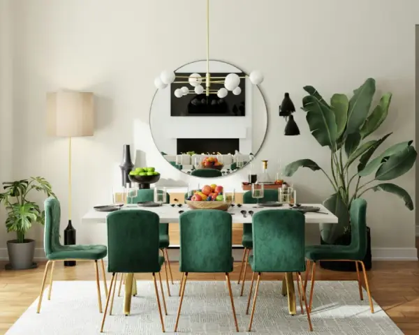 Une arche élégante sépare le salon de la salle à manger, révélant une table dressée avec des chaises en velours vert émeraude.