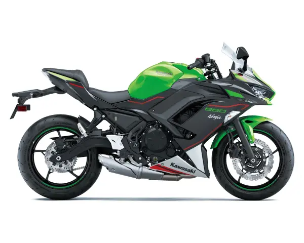 Zielono-czarny Kawasaki Ninja 650, gotowy do osiągnięcia swojej prędkości maksymalnej.