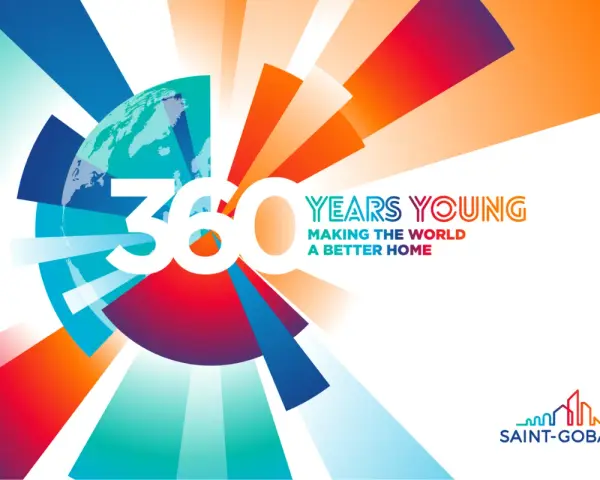 360 lat Saint-Gobain: "Making the World a Better Home". Kolorowa grafika z globusem i promieniami.