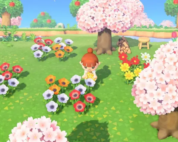 Una jugadora de Animal Crossing New Horizons admira un campo de flores de cerezo y anémonas de colores.