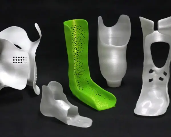 A collection of orthopedic devices, including braces and prosthetic components, showcase the versatility of polypropylene 3D printing.