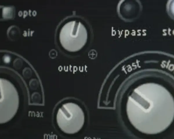 Panel urządzenia audio z pokrętłami i przełącznikami, w tym "output" i "fast/slow", sugeruje kontrolę nad dynamiką, jak w przypadku **noise gate**.