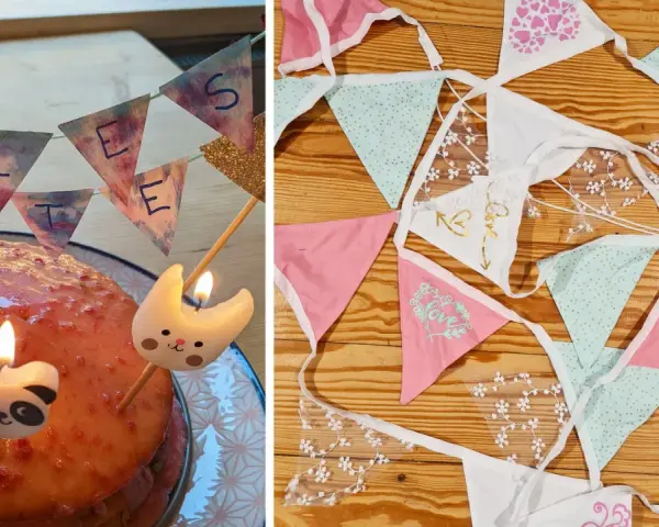 Geburtstagstorte mit Kerzen und einer selbstgemachten Wimpelkette. Daneben liegen weitere bunte Wimpelketten zum Basteln.