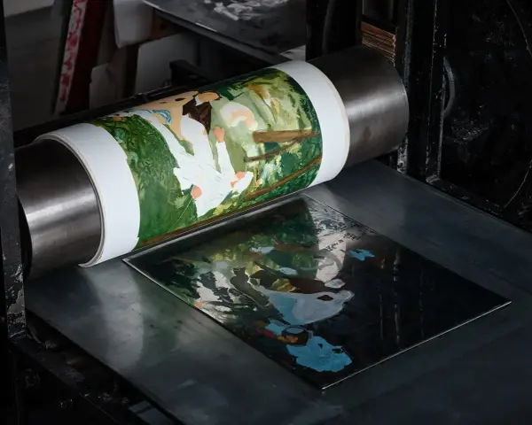 Impression d'une scène champêtre sur une presse, illustrant les différents types de gravure.