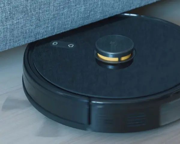 En robotdammsugare navigerar under en soffa, visar hur fungerar en robotdammsugare.