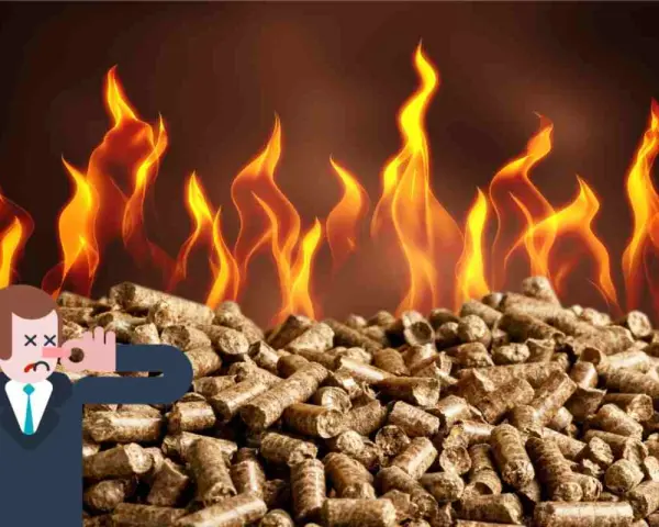 Uomo con naso tappato su mucchio di pellet, fiamme sullo sfondo. La stufa pellet puzza da spenta.