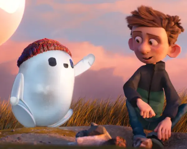 Chłopiec i robot Ron, bohater jednej z warner bros bajek, siedzą na wzgórzu podczas zachodu słońca.