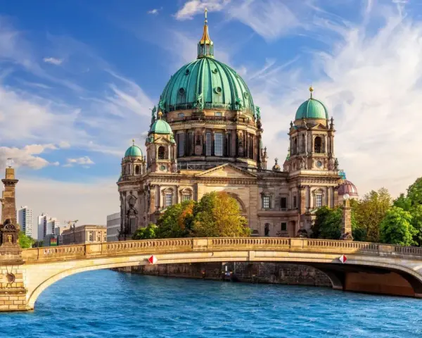 A stunning view of Berlin Cathedral across the Spree River, perfect for your next travel to Berlin.