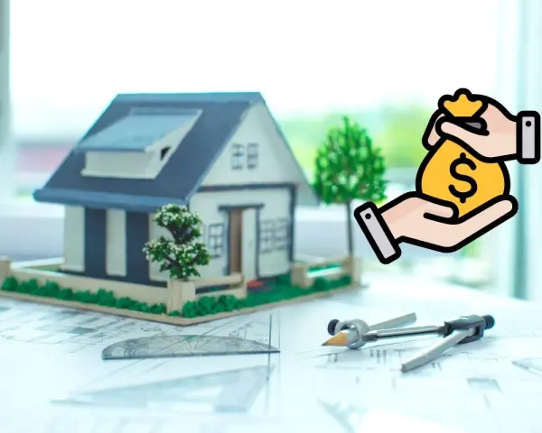Maquette de maison sur plans, symbolisant l'indemnisation terrain devenu non constructible. Argent donné.