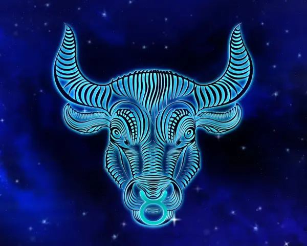 Błękitny, neonowy byk z gwiazdami na tle. Symbol zodiaku Byk, jaki żywioł? Ziemia, siła i stabilność.