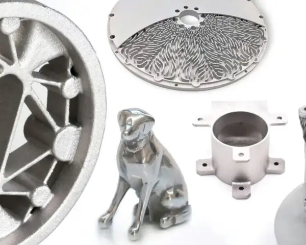 Metalowe wydruki 3D: koło, pies, okrągły element z ażurowym wzorem i części mechaniczne.