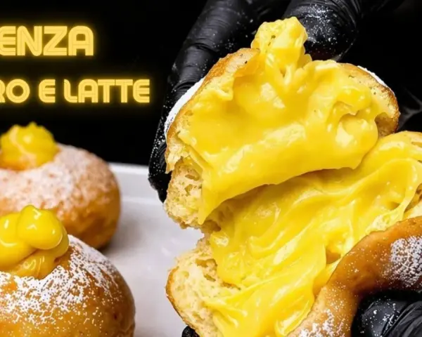 Bomboloni alla crema, soffici e ripieni, senza burro e latte. Un'esplosione di dolcezza.