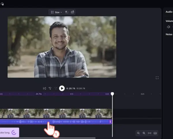 Edytor wideo Clipchamp. Panel audio z suwakiem głośności i opcją redukcji szumów (noise floor).