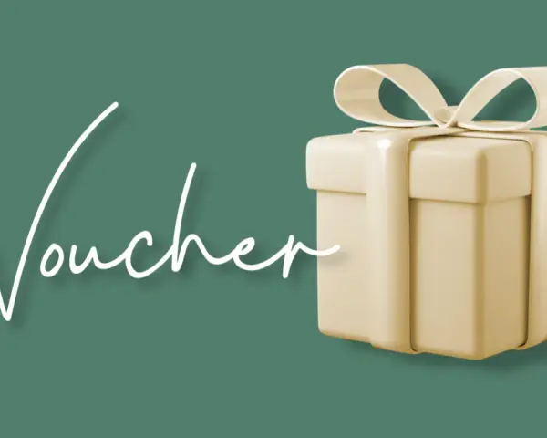Elegancki prezent z napisem "Voucher" i wstążką. Idealny na relaks w Termach Chochołowskich.