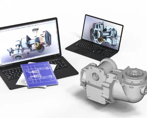 Dwa laptopy z wizualizacjami 3D mechanizmów, niebieskie plany i model części. To efekt pracy z programem cad skrót.