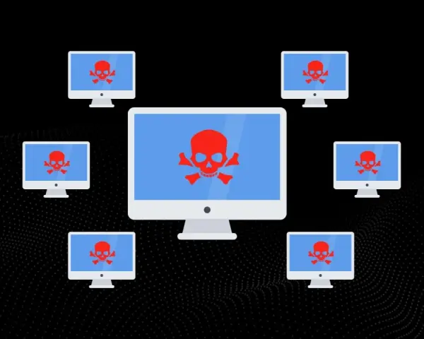 Komputery z czerwonymi czaszkami na ekranach, symbolizujące atak DDoS.