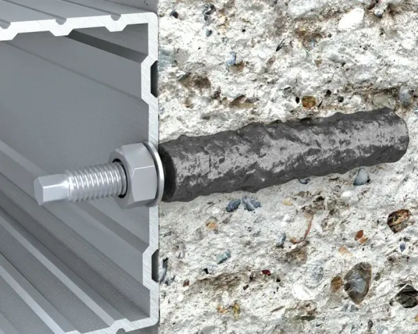 Przekrój pokazuje, jak kotwy chemiczne mocują profil aluminiowy do betonu, zapewniając solidne połączenie.
