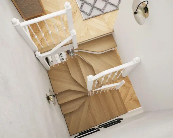 Eleganckie klatki schodowe w domu, z białymi balustradami i drewnianymi stopniami, tworzą stylową przestrzeń.