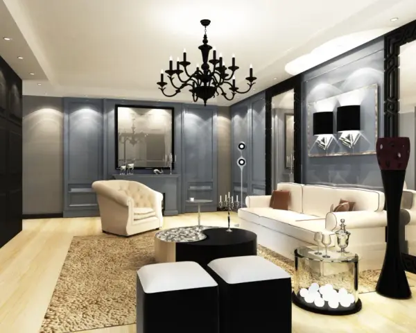 Elegancki salon w gotyckim stylu, z czarnym żyrandolem, kremową sofą i fotelem, ozdobiony lustrami i geometrycznymi akcentami.