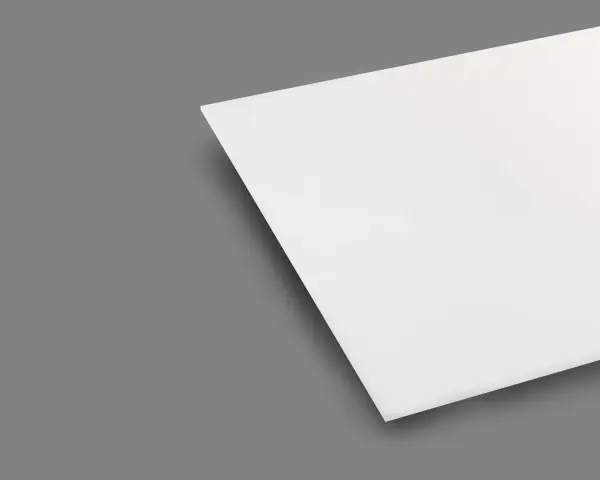 A white sheet of plexiglass is shown on a gray background. This material is known for being heat resistant, making it suitable for various applications.