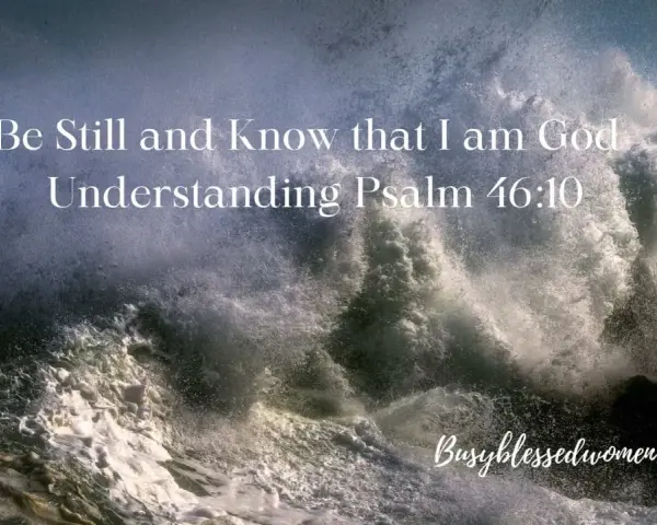 A powerful wave crashes against rocks, with text overlay: "Be Still and Know that I am God. Understanding Psalm 46:10.