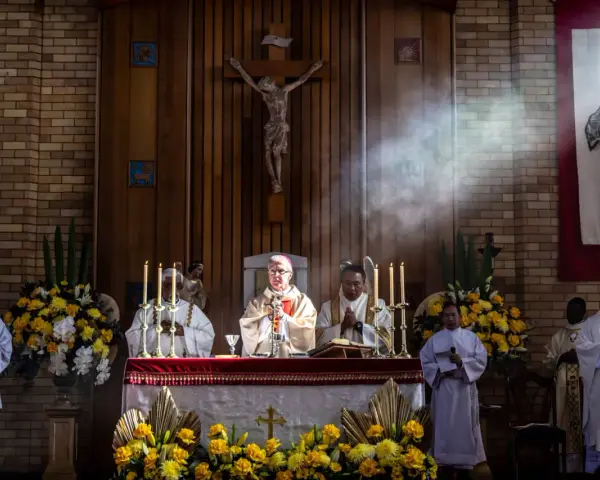 Clergy at an altar during a religious service. The length of vigils can vary, but this scene captures a moment of solemnity.