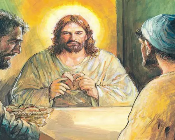 Jezus w Emaus łamie chleb z uczniami. Wokół niego złota poświata.