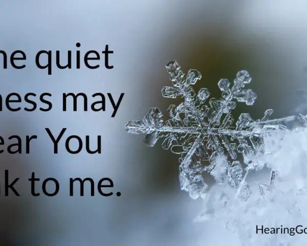 A snowflake rests on snow, with text about finding God's voice during a christian silent retreat.