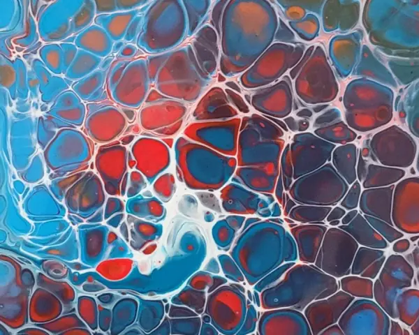 Tableau peinture acrylique facile à faire, aux cellules bleues, rouges et blanches, rappelant une structure cellulaire ou un réseau organique.
