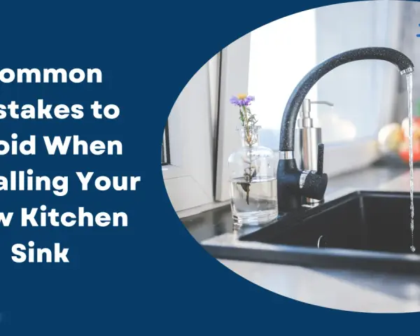 Water flows into a new black kitchen sink. Learn common mistakes to avoid when installing your new kitchen sink.