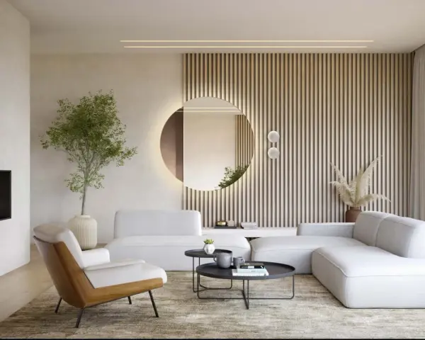 Nowoczesny salon z białymi sofami, kominkiem i okrągłym lustrem Kent, które dodaje elegancji.
