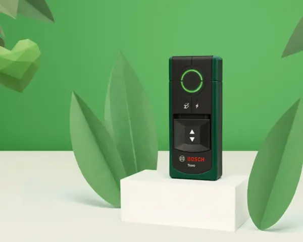 El detector Bosch Truvo, uno de los tipos de detectores, se muestra rodeado de hojas verdes y un corazón de papel.