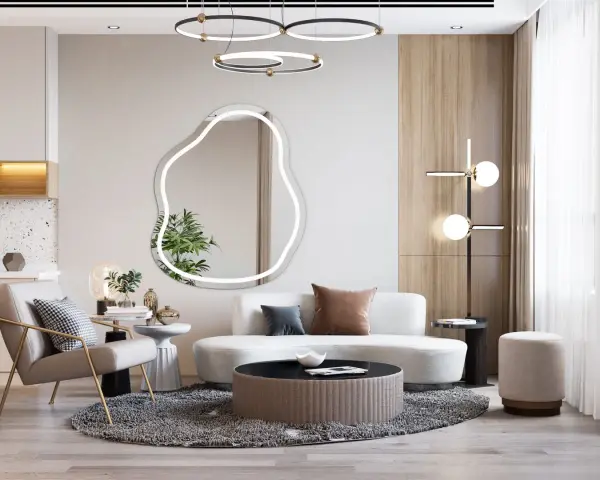 Nowoczesny salon z fotelem, sofą i stolikami. Lustro o nieregularnym kształcie przypomina cloud dancer.