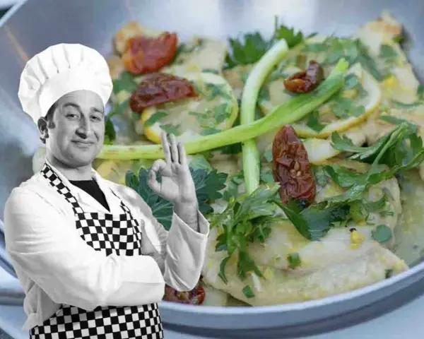 Chef approva scaloppine al limone cremose, un piatto invitante con limone, pomodori secchi e prezzemolo.