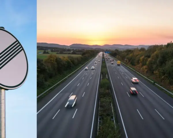 Slut på hastighetsbegränsning på en tysk Autobahn vid solnedgången. Bilar susar fram på motorvägen.
