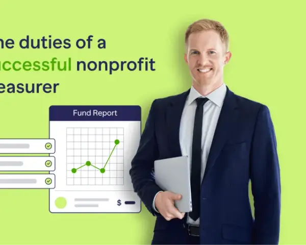 A smiling man in a suit holds a tablet, with a fund report graphic showing growth. He embodies the duties of a successful nonprofit treasurer.